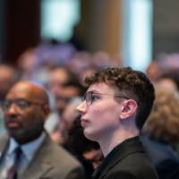 Student listening to the West Michigan Economic Forecast